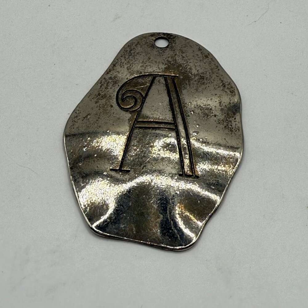 Silver Metal Pendant With Engraved Letter A And Organic Shape Design